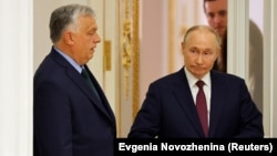 Hungarian Prime Minister Viktor Orban (left) and Russian President Vladimir Putin meet in Moscow on July 5.