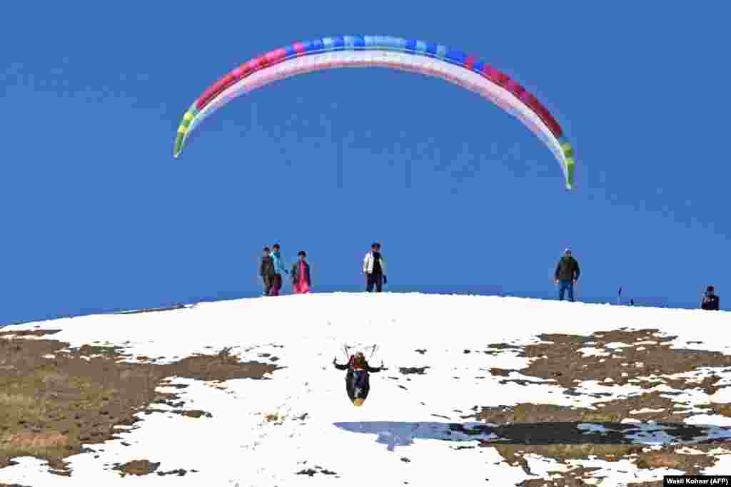 An Afghan paraglider takes off on the outskirts of Bamiyan Province.