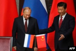 Vladimir Putin și Xi Jinping, la Kremlin.