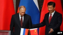 Рускиот претседател Владимир Путин и кинескиот претседател Си Џинпинг