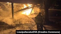 A Ukrainian firefighter battles a blaze at an oil refinery in Kremenchuk on November 1. 