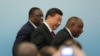 Președintele chinez Xi Jinping, președintele sud-african Cyril Ramaphosa și președintele senegalez Macky Sall la summitul de cooperare China-Africa din 2018 de la Beijing.