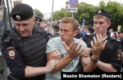 Police detain Navalny during a rally in June 2019. His constant refrain that authoritarianism will not last forever in Russia has resonated with many young people whose entire lives have been spent under Putin.