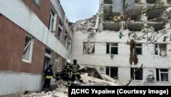Rescuers work at the site of a Russian missile strike in Chernihiv on April 17.