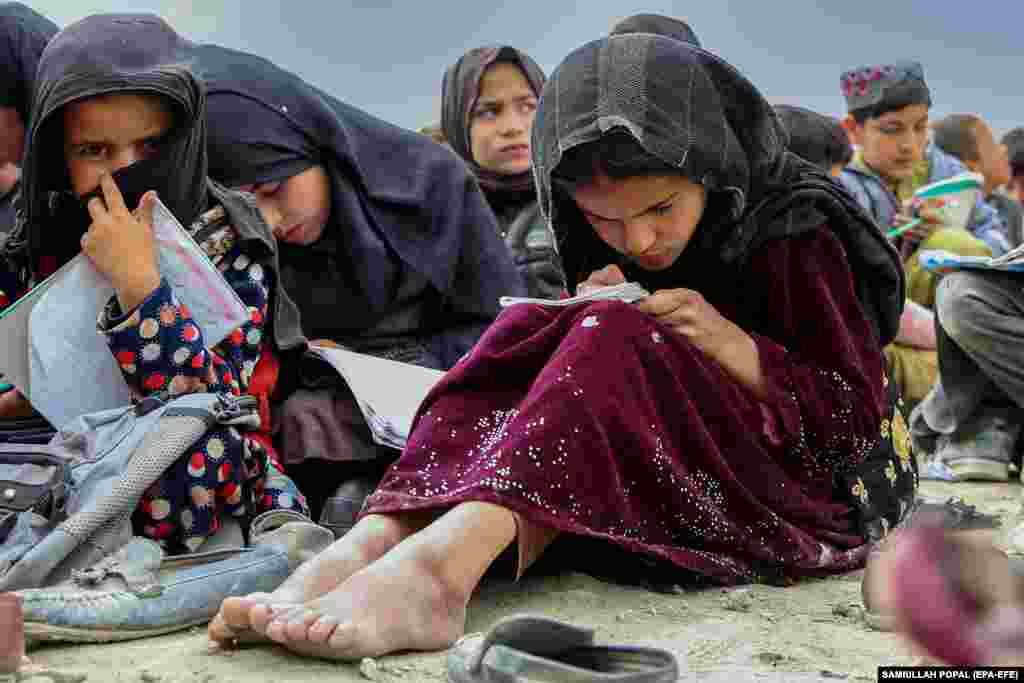 Afghan children attend an open-air school in Kabul. A young volunteer, Wazir Khan, who himself is a university student, has undertaken an initiative called Today&#39;s Child to provide free education to approximately 500 children who can&rsquo;t afford to go to school as there is no school in their neighborhood.