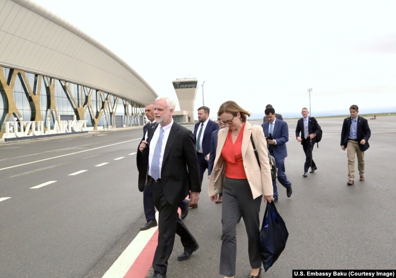 U.S. Ambassador to Azerbaijan Mark Libby alongside his wife, Danusia, on the tarmac of Fuzuli international airport on May 6. The airport is in territory recently recaptured from ethnic Armenian forces.