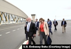 U.S. Ambassador to Azerbaijan Mark Libby alongside his wife, Danusia, on the tarmac of Fuzuli international airport on May 6. The airport is in territory recently recaptured from ethnic Armenian forces.