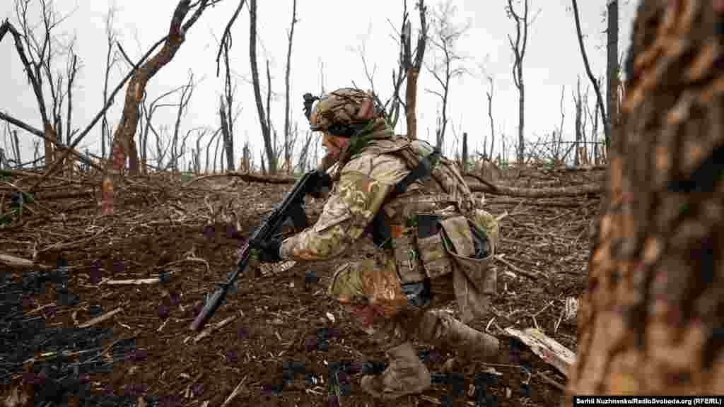 A Ukrainian soldier advances toward Russian positions amid the shattered landscape. Kyiv said the situation in Bakhmut continues to be difficult and cautioned that Moscow had not changed its goal of capturing the city and was sending assault troops to Bakhmut&#39;s outskirts.