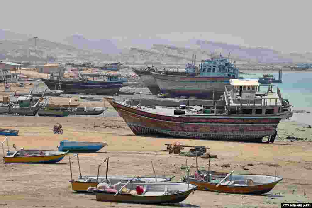 As modern boats become cheaper and faster, the use of traditional wooden vessels is decreasing, with many sitting idle.