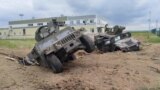 This image, showing U.S.-made Humvees in an apparent explosion crater, is from a video released by Russian authorities on May 23 after what is described as a cross-border raid into Russia&#39;s Belgorod region that began a day earlier.