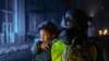 A police officer carries a boy at the site of an overnight Russian rocket attack in Kharkiv on January 16.&nbsp;<br />
<br />
At least 17 people were wounded, two seriously, in the latest attacks on the city, according to regional Governor Oleg Syniehubov.<br />
<br />
&nbsp;