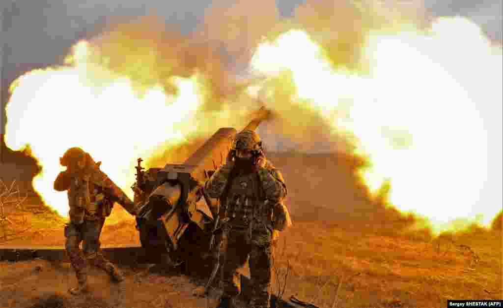 Ukrainian servicemen fire a 122-mm howitzer D-30 at Russian positions on March 21. Despite Russia&#39;s Wagner mercenary group claiming to have seized up to 70 percent of the ruined city, Ukraine refuses to relinquish control. &nbsp;