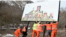 Kosovar authorities remove a billboard featuring pictures of Serbian President Aleksandar Vucic and Russian President Vladimir Putin, among others, in Zvecan, north Kosovo, on January 25.