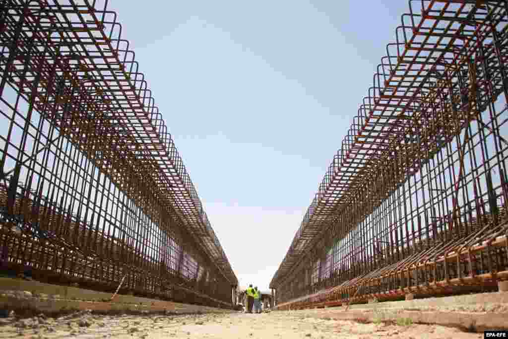 Laborers work at the Qush Tepa Canal construction project in northern Balkh Province, Afghanistan.