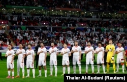 Tajikistan players during the national anthem before the match on January 28.