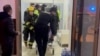 Firefighters evacuate patients at the Perinatal Center in Baku after a fire broke out early on January 9.