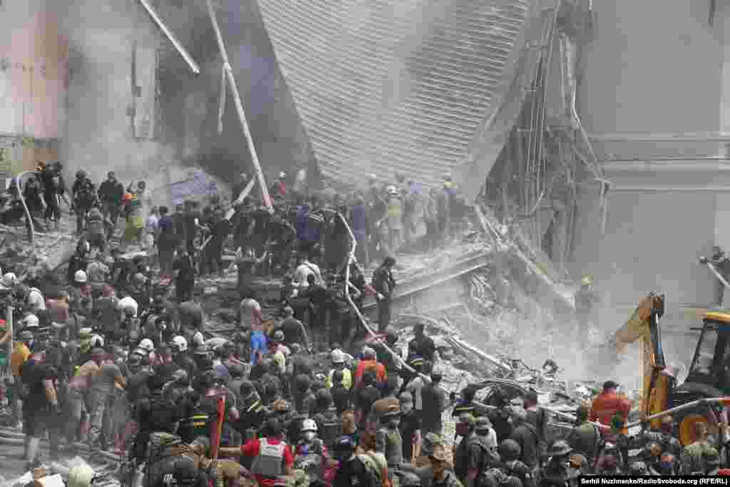 Volunteers, doctors, and rescue workers search for survivors at the Okhmatdyt Children&#39;s Hospital in Kyiv following a deadly Russian missile attack on July 8. Ukrainian authorities said at least 24 people were killed and dozens injured in a &quot;massive&quot; Russian daytime missile attack on the capital and other cities. &nbsp;