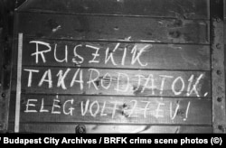 Street graffiti that says, “Russians get out of here, 27 years was enough!” The scrawled message references the ongoing presence of Soviet troops in Hungary following the Red Army’s capture of the country in 1945.