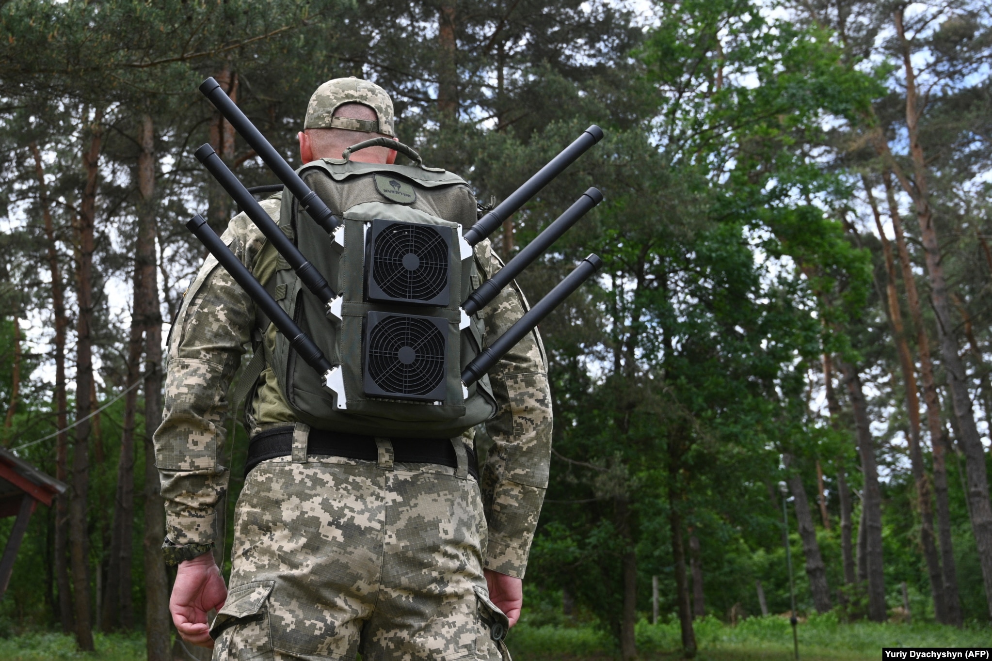 A Ukrainian soldier wears an “anti-drone backpack” during a demonstration of jamming devices in the Lviv region in May.