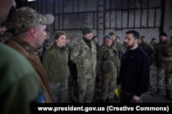 President Volodymyr Zelenskiy talks to Ukrainian soldiers near Bakhmut on March 22.