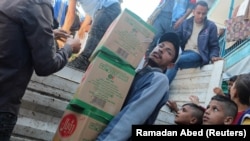 روند توزیع کمک ها به باشنده های نیازمند غزه