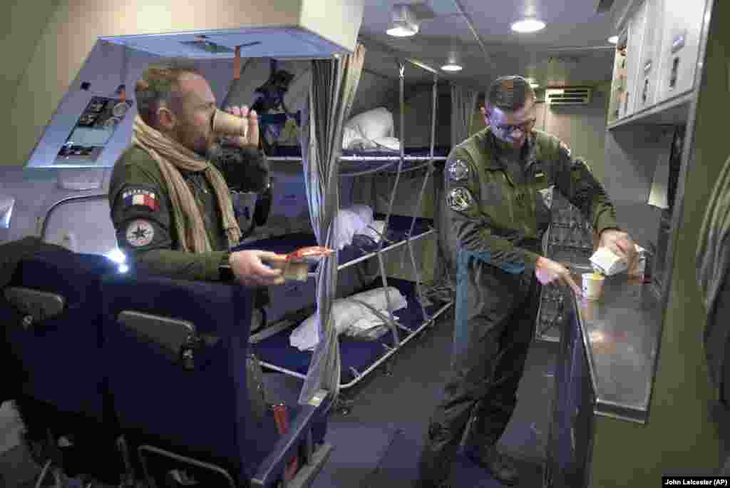 Crew members break for refreshments in the galley. NATO also has its own fleet of&nbsp;14 AWACS&nbsp;that are also modified Boeing 707s that first flew in 1957 but stopped carrying passengers commercially in 2013. It says one AWACS can surveil an area the size of Poland; three can cover all of Central Europe. &nbsp;