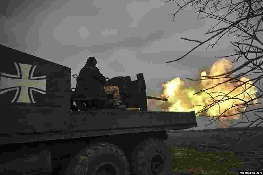 Ukrainian soldiers fire an S60 antiaircraft gun at Russian positions near Bakhmut on March 20. &quot;At the moment, Wagner units control around 70 percent of the city of Bakhmut,&quot; claimed Yevgeny Prigozhin, the head of the Russian mercenary group, on March 20. &nbsp;