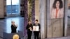 Kiana (center) and Ali Rahmani, Narges Mohammadi's children, accept the Nobel Peace Prize on behalf of their mother (upper right) in Oslo in December 2023.