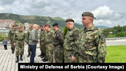Serbian Defense Minister Milos Vucevic with members of the Serbian Army in May