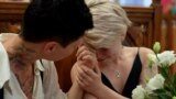 Buenos Aires, Argentina -- A Russian LGBT couple holding hands while getting married