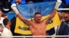 Oleksandr Usyk celebrates winning a fight in Wroclaw, Poland, in August 2023.