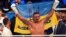 Oleksandr Usyk celebrates winning a fight in Wroclaw, Poland, in August 2023.