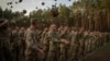 Newly recruited soldiers celebrate the end of their training at a military base close to Kyiv on September 25, 2023.