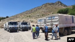 تصویر آرشیف: کارمندان و وسایط امداد رسانی برنامه جهانی غذا در افغانستان 