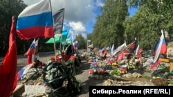 The graves of people who died in the Ukraine war at a cemetery in Prokopyevsk.