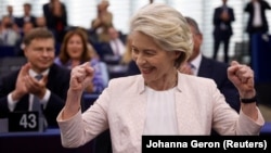 Ursula von der Leyen celebrates the vote.