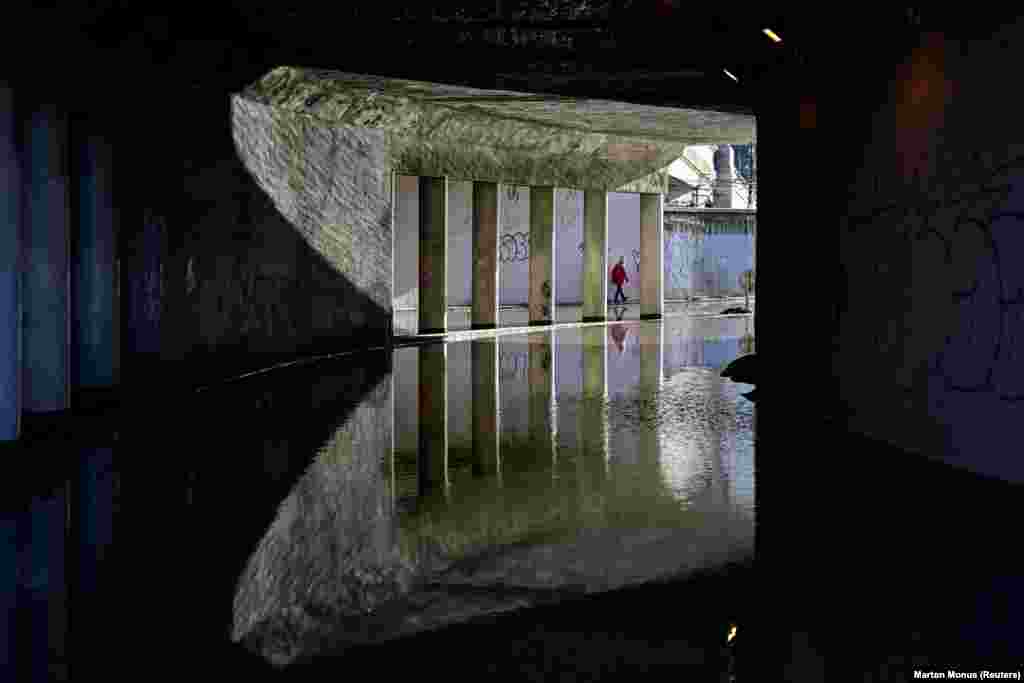 A child walks in a nearby flooded tunnel... &nbsp;