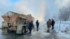 Utility workers tackle the consequences of a burst pipe in Novosibirsk on January 18. 