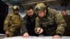 Ukrainian President Volodymyr Zelenskiy (center) visits the advanced command post in Kupyansk, Kharkiv region, on November 30.