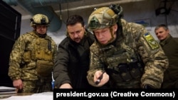 Ukrainian President Volodymyr Zelenskiy (center) visits the advanced command post in Kupyansk, Kharkiv region, on November 30.