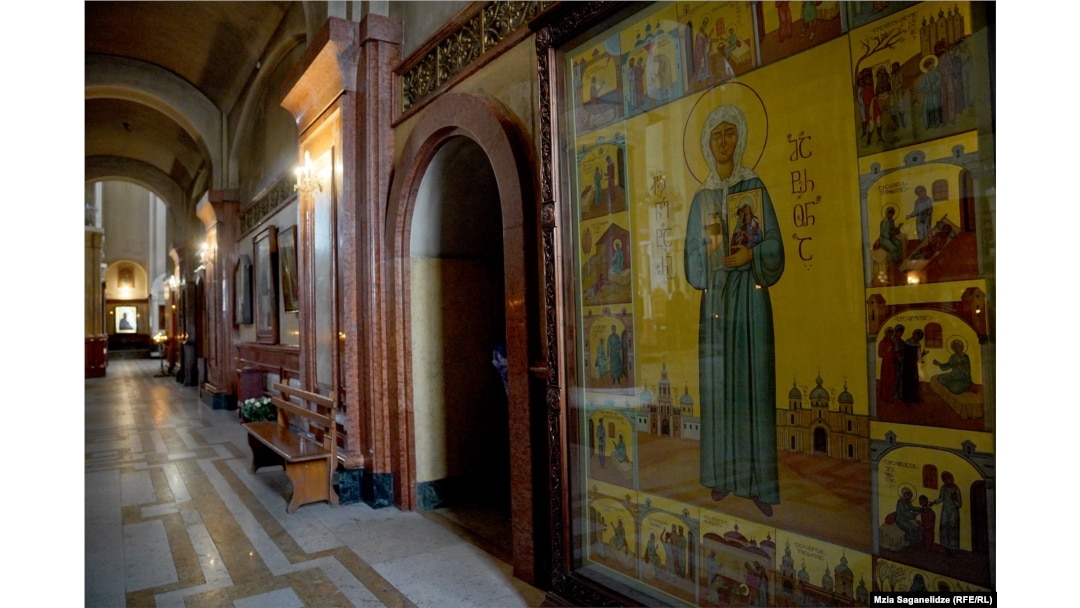 The icon in a corner of the Holy Trinity Cathedral. The Stalin panel can be seen on the lower left of the artwork.