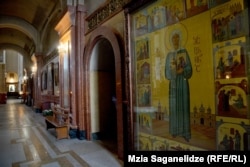 The icon in a corner of the Holy Trinity Cathedral. The Stalin panel can be seen on the lower left of the artwork.