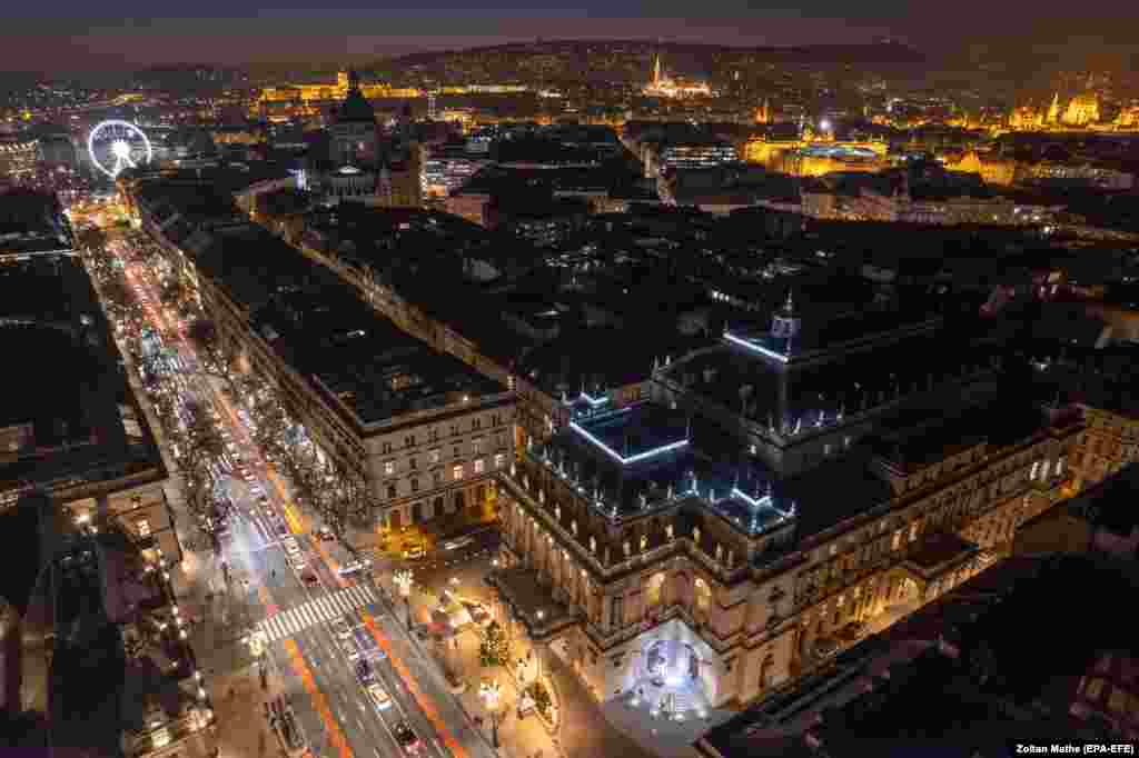 An image made with a drone of the illuminated Hungarian State Opera House Andrassy Avenue in downtown Budapest.