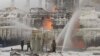 Russian firefighters attempt to extinguish a blaze at a gas terminal in the Baltic Sea port of Ust-Luga on January 21. 