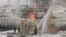 Russian firefighters attempt to extinguish a blaze at a gas terminal in the Baltic Sea port of Ust-Luga on January 21. 