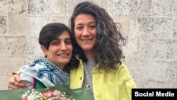Elaheh Mohammadi (left) and Niloofar Hamedi face new charges just hours after being released from prison.

