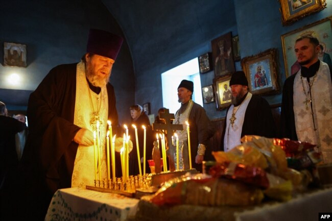 A church service is held on January 24 for those killed in the Il-76 incident in the village of Yablonovo, near the crash site