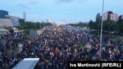 Protesters walked behind a banner reading "Serbia Against Violence" to the busiest bridge leading into Belgrade, blocking it for two hours.