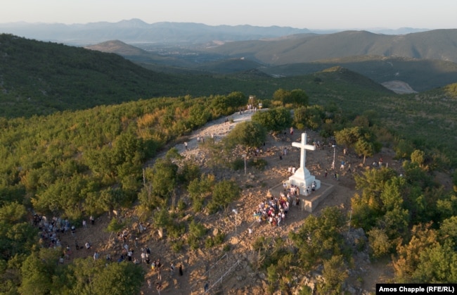 A group of Catholic Ukrainians pose for a photo atop Cross Mountain on August 4.