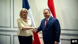 Premierul maghiar Viktor Orbán și Marine Le Pen, 29 ianuarie 2022, la Madrid.